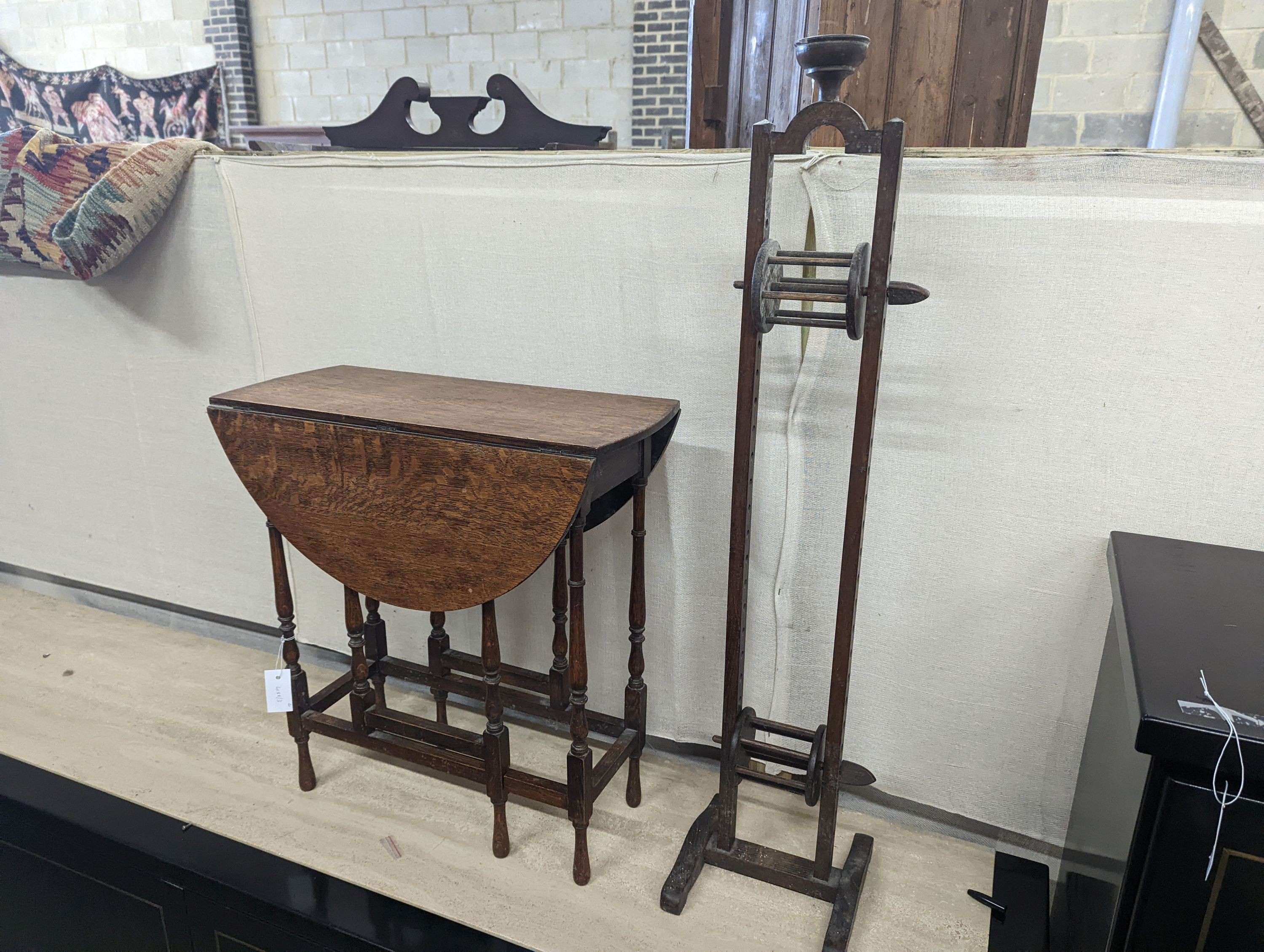 A Sutherland spider leg table and bobbin/wool winder, height 105cm